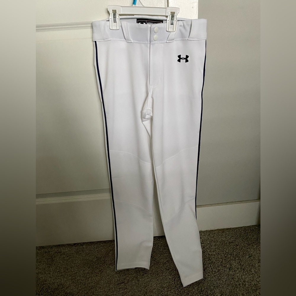 Under Armour White with Navy piping. New with without tags. Size youth medium.